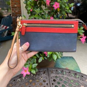 Navy and coral Coach wristlet